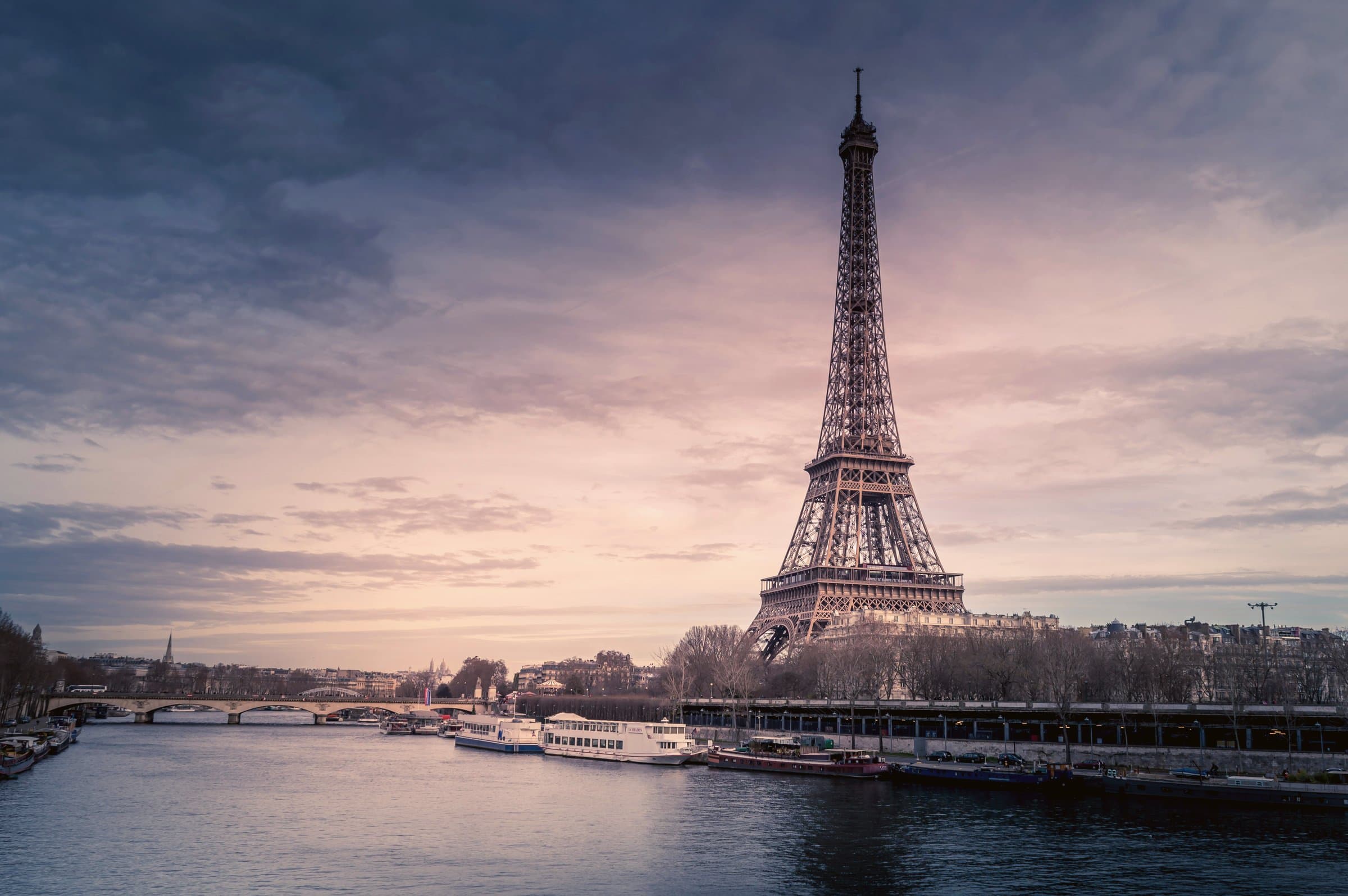 The Eiffel Tower reflected in the Seine at sunset, Paris, France