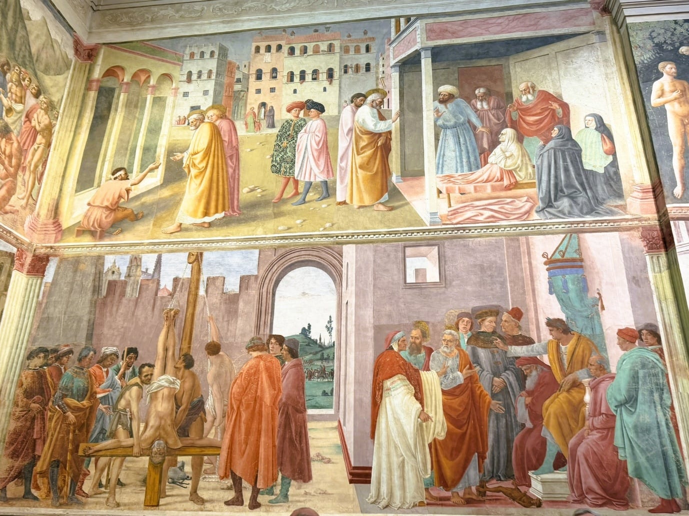 Frescoes on the wall of the Brancacci Chapel, including the Tribute Money and the Crucifixion of St Peter