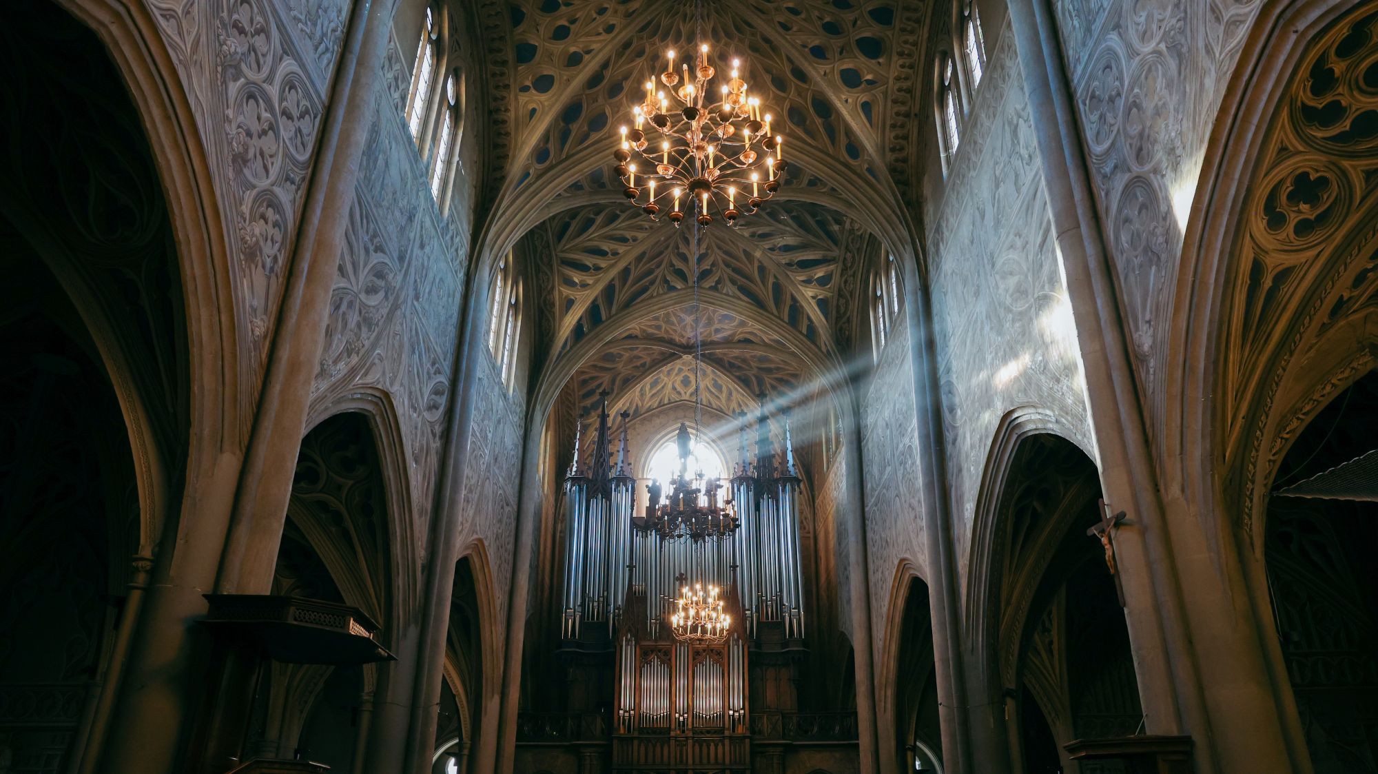 Sunlight falling through the vaulted interior of a historic church in Chambéry