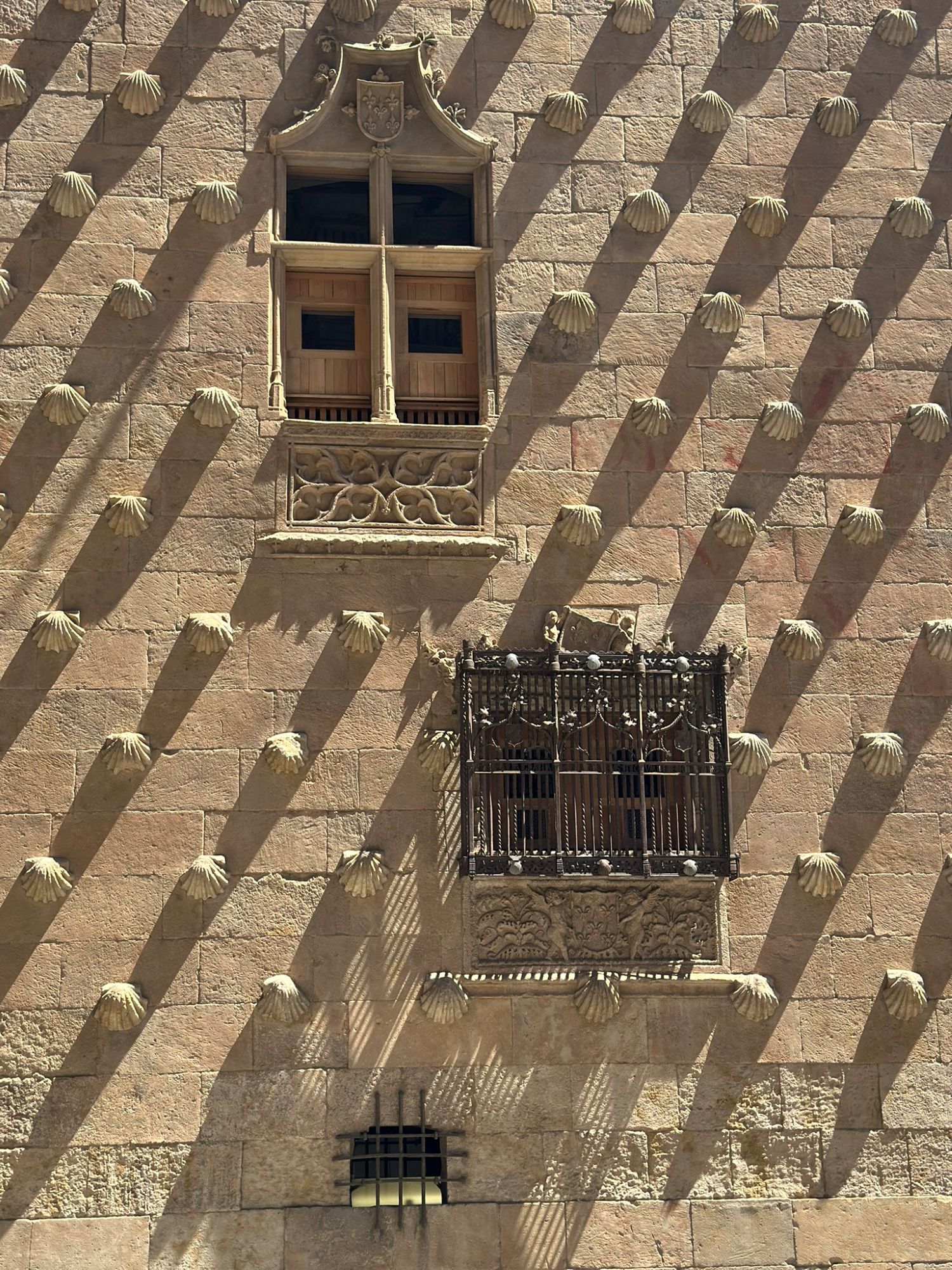 Carved stone scallop shells covering the façade of the Casa de las Conchas
