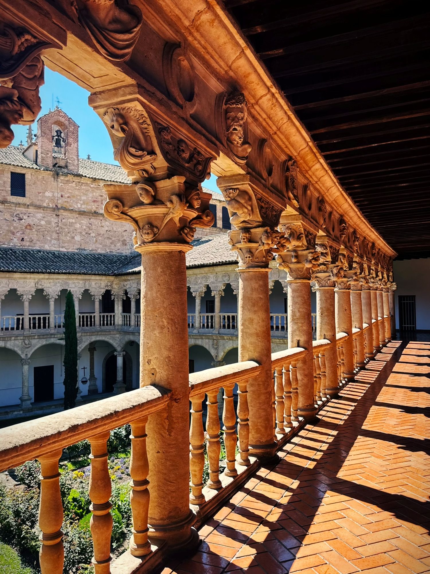 The upper gallery of the Renaissance cloister at the Convento de las Dueñas, with its carved capitals