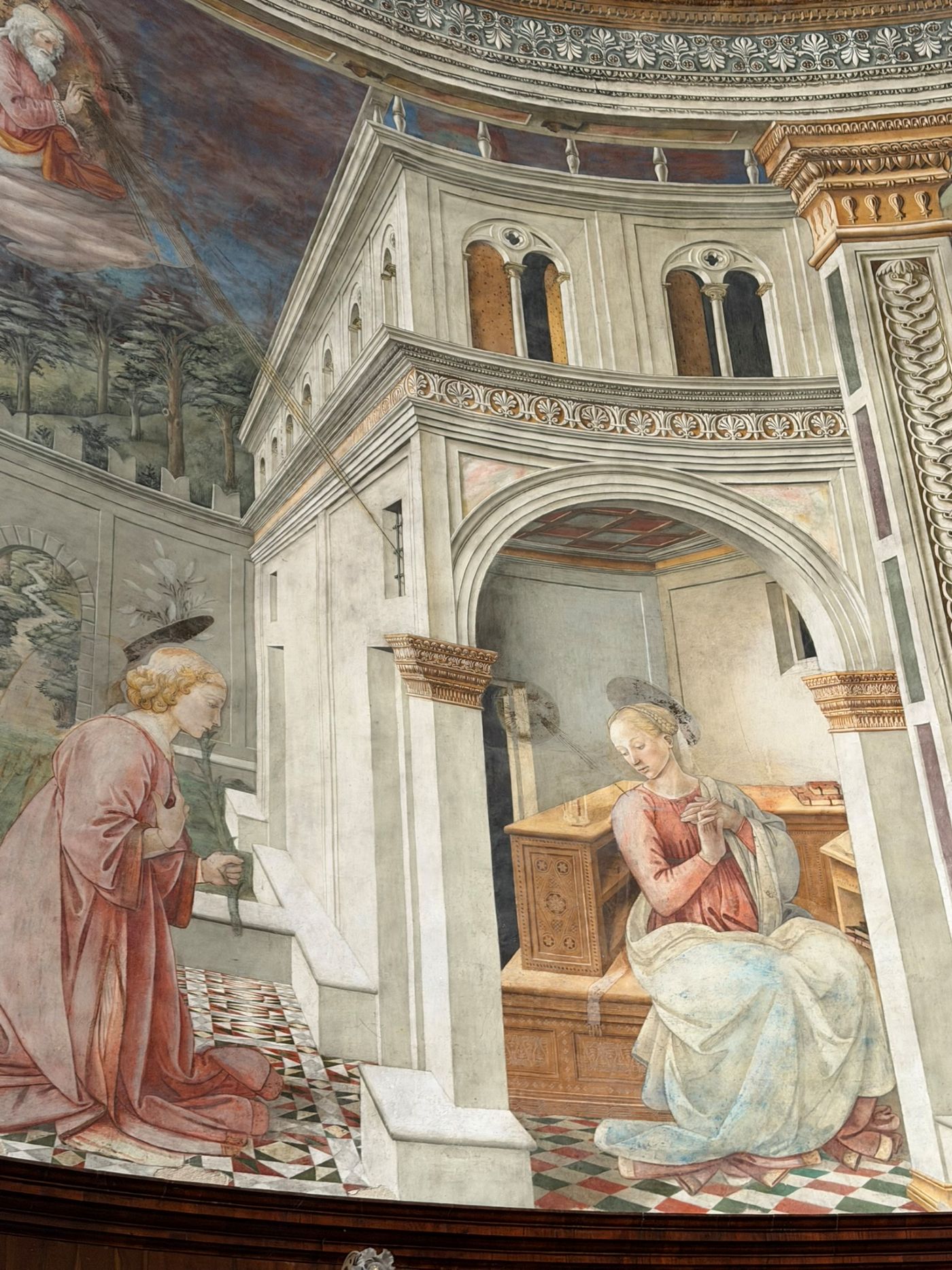 The Annunciation in Filippo Lippi's frescoes in Spoleto Cathedral, the angel kneeling before Mary